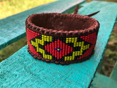 Red and Light Olive Green Men’s Tribal Beaded Cuff on Brown Deer Hide